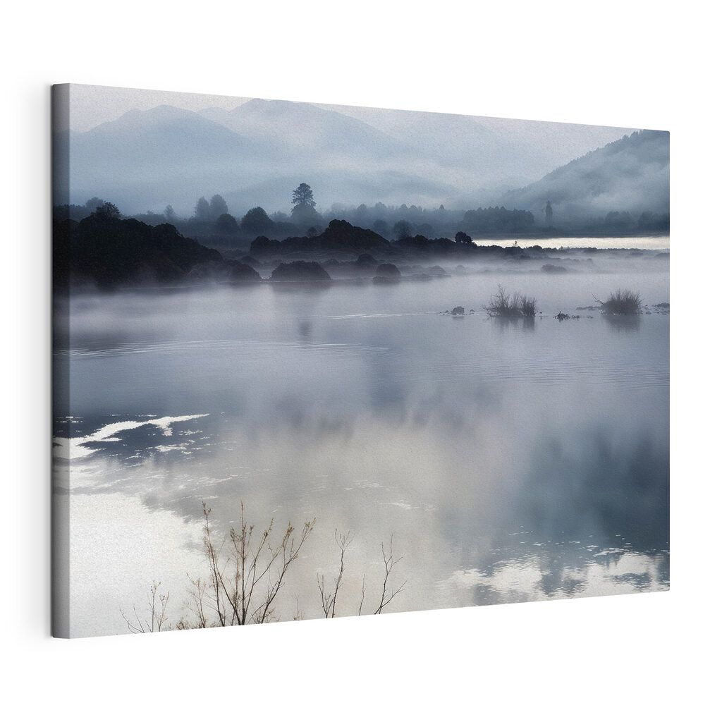 Foggy landscape with mountains and water