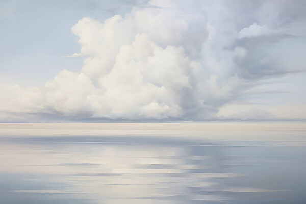 Large body of water with clouds in the sky