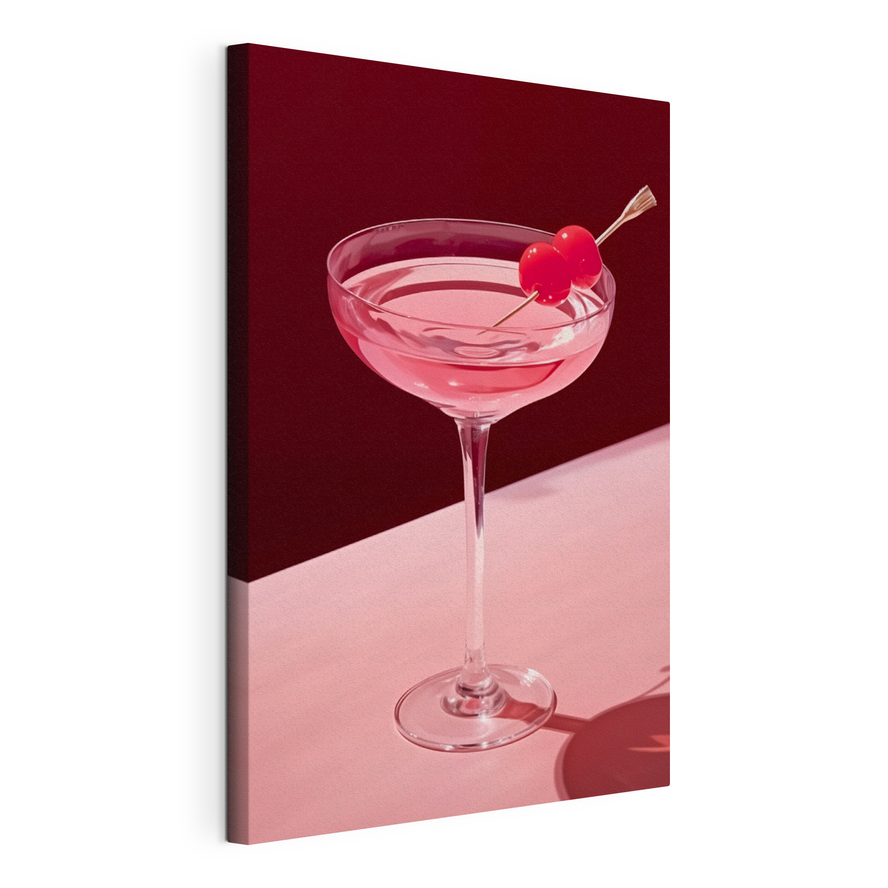 Glass with pink liquid and two cherries on it