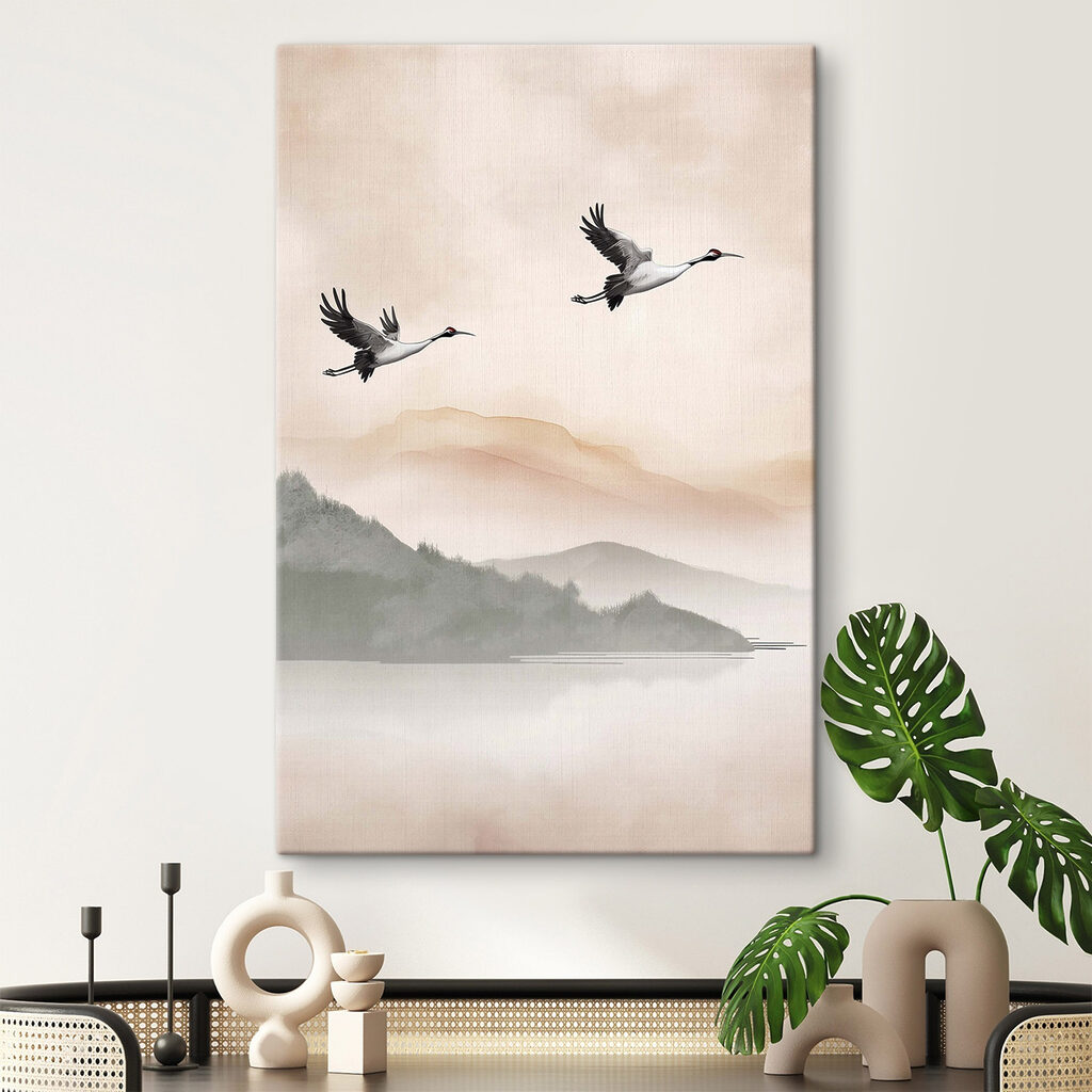 Two birds flying over a lake